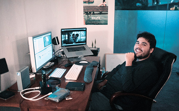 Film editor, Adrian Morales Ramos, working on post-prod
