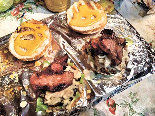 Burgaholic’s Secret Special Sauce, the flame grilled bacon on top of the 100 percent sirloin beef patties!