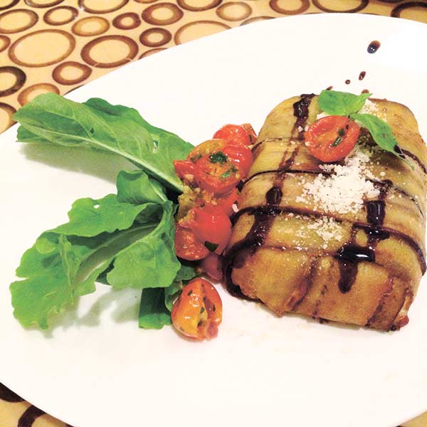 A layered eggplant cake filled with buffalo mozzarella.