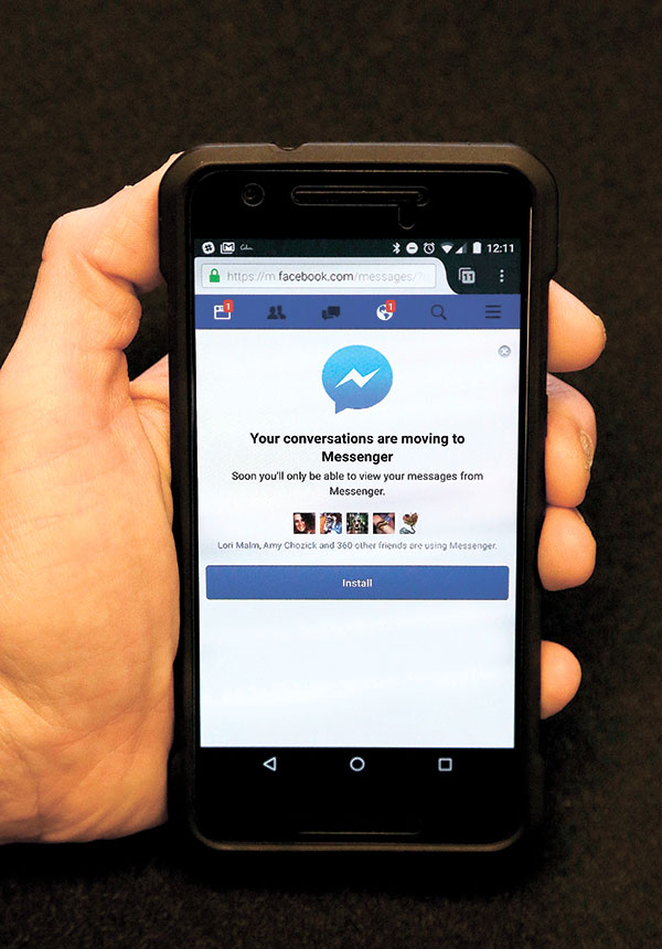 FACE BLOCK? Facebook is pushing more people to install its Messenger application, now by blocking people who want to send and receive messages via its mobile website instead of the app. (AP PHOTO)