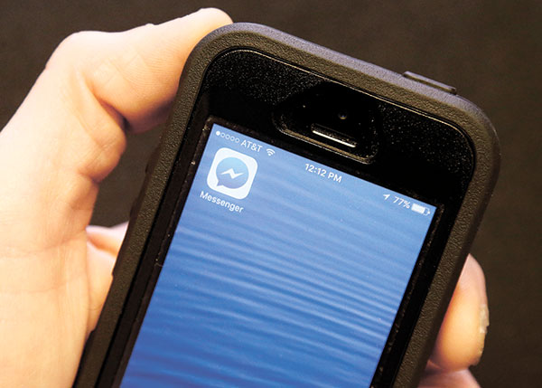 MESSAGING AND MORE. Facebook Messenger goes beyond messaging. Find out what a separate Messnger app offers. (AP PHOTO)