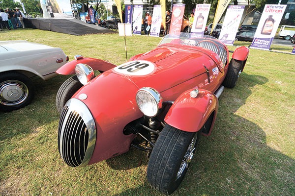 a kougar is parked on a grassy lot at the cebu business park.